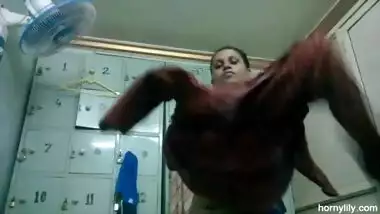 Horny Lily taking off her clothes in the locker room